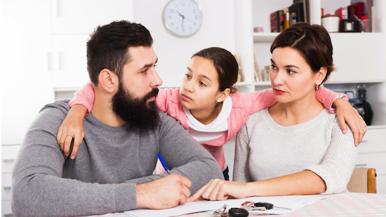 Husband and wife talking about a Mutual Consent Divorce amicably with daughter